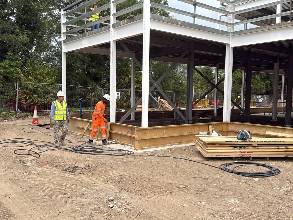 Ground-beam formwork set out beneath a new steel frame