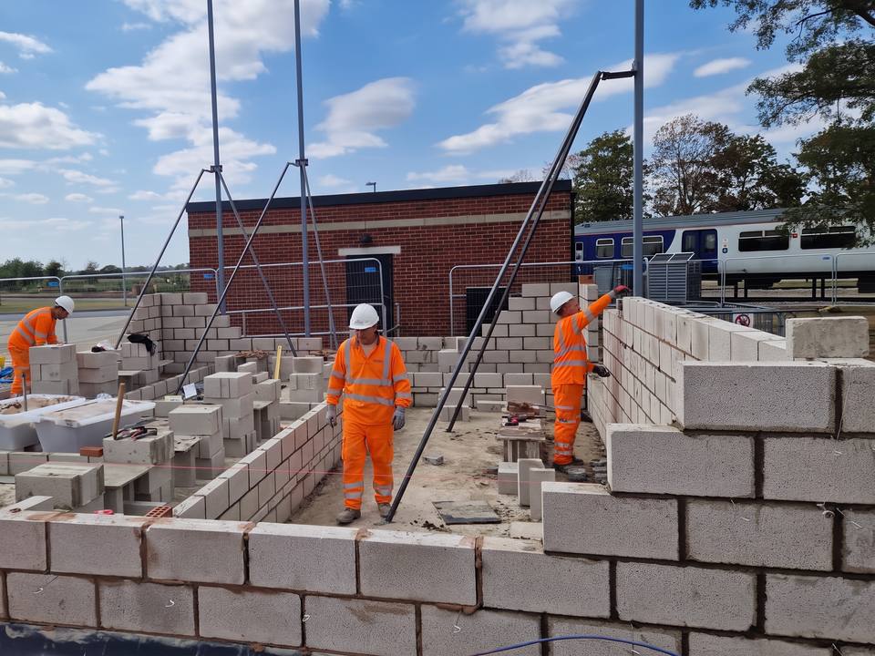 Blockwork walls rising off a concrete slab